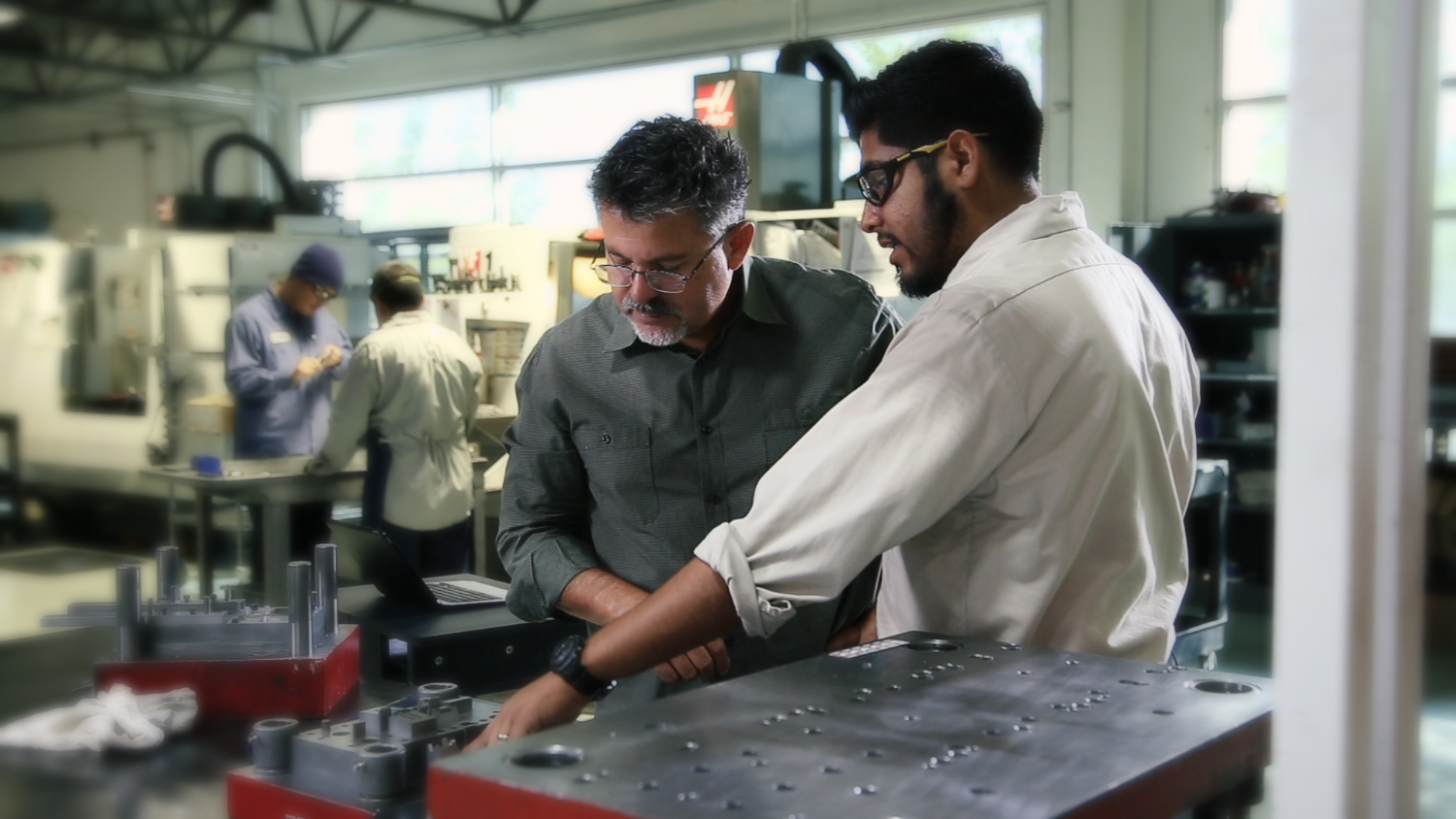 Vision Engineering team collaborating in the factory